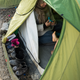 Mar. 1, 2016 – Idomeni, Greece. A refugee puts a sock on a child’s foot in a tent.